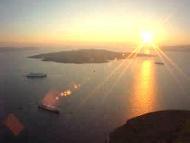 Harry's Greece Travel Guide weddings honeymoons and renewal of vows in cyclades islands santorini sunset and cruise boats below