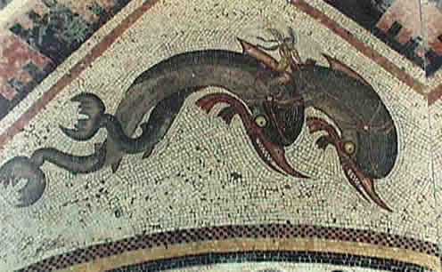 an ancient mosaic of doplhins with rider