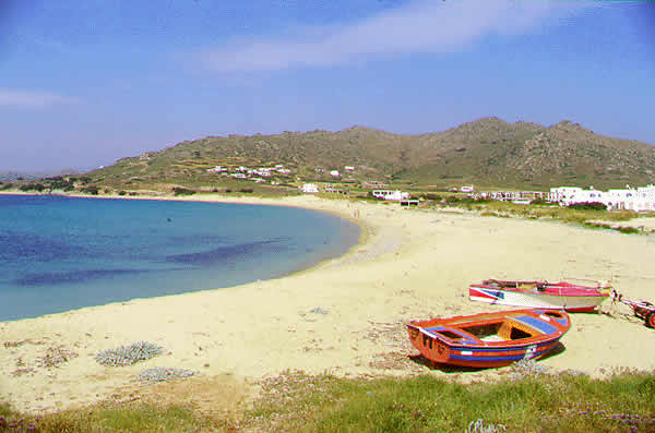 a quiet beach with fishing boats