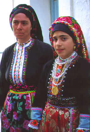 female villagers in traditional costumes
