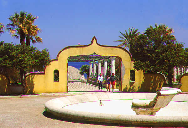 an arch with a fountain